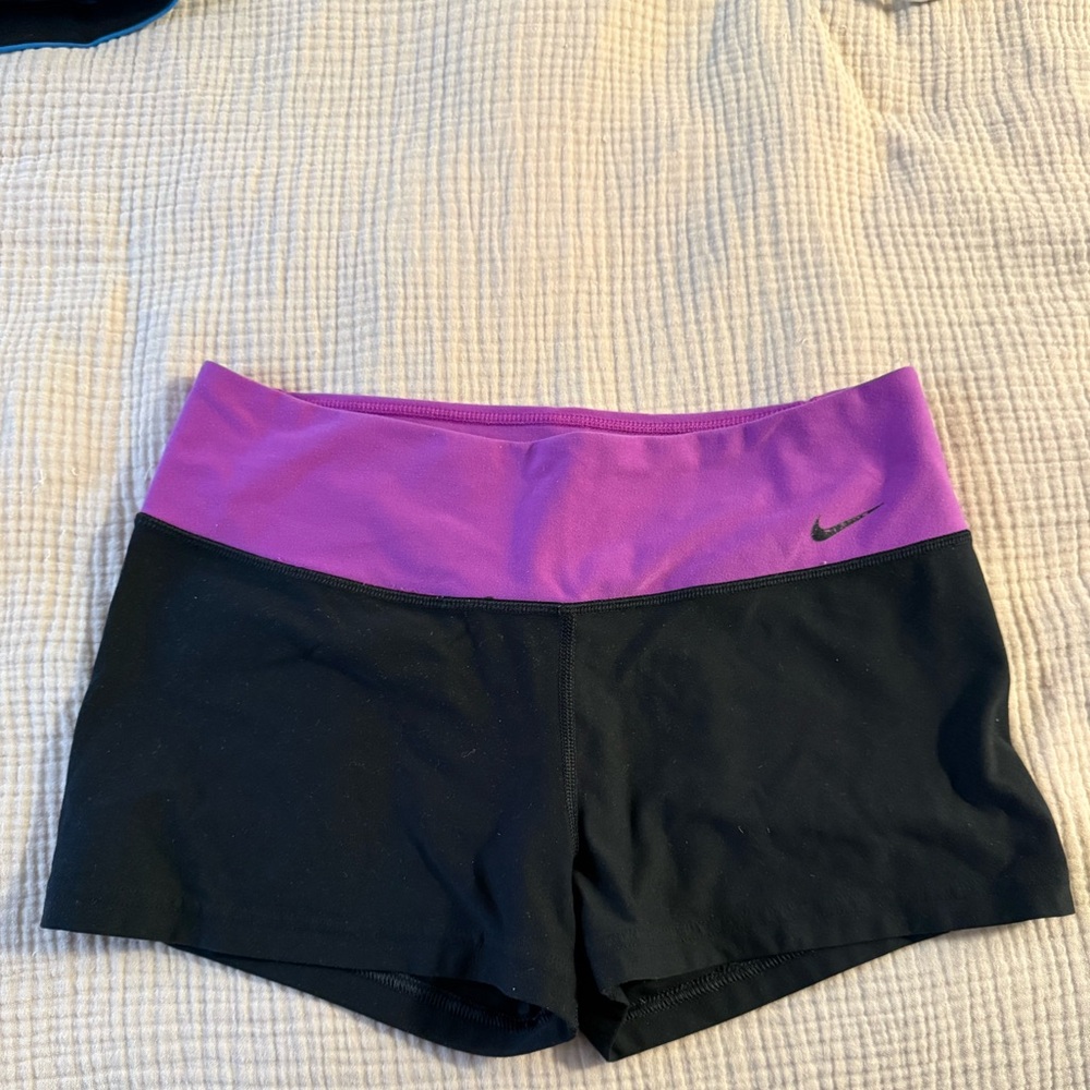 Nike women's training shorts in black and purple with Dri-FIT technology
